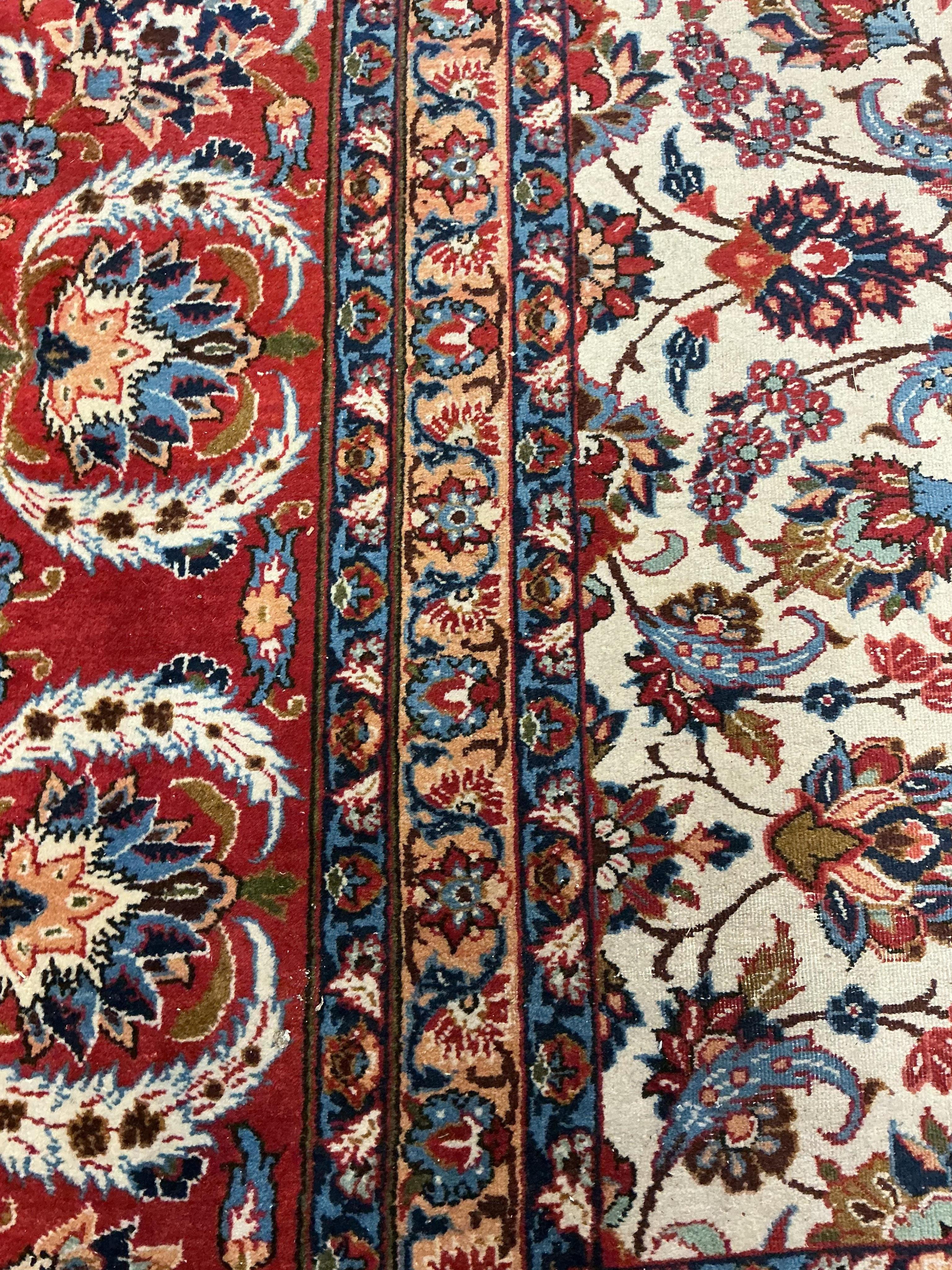 A North West Persian ivory ground floral carpet, 350 x 254cm